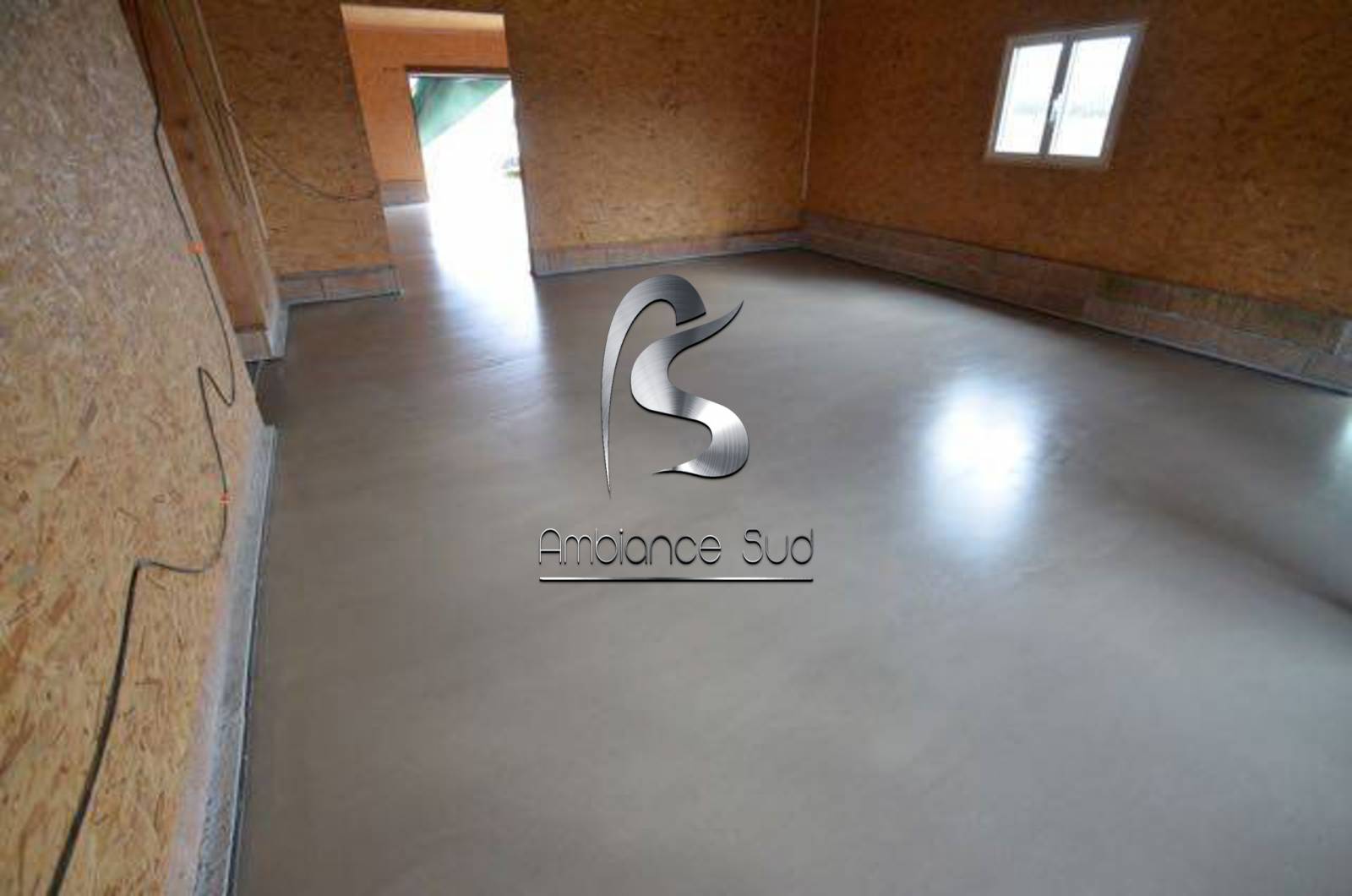 Pose d'une couche d'usure dans une mielerie à Brignolles